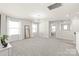 Expansive living room featuring multiple windows, modern light fixture, and neutral decor at 1020 Clementine Rd, Monroe, NC 28110