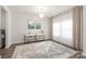 Elegant living room with light gray floors, decor, and a stylish rug, bathed in natural light at 1020 Clementine Rd, Monroe, NC 28110