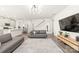 Bright, open-concept living space leading to the kitchen and staircase at 1020 Clementine Rd, Monroe, NC 28110