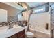 Full bathroom features tiled walls and floors, updated vanity and shower-tub combo at 10836 Maryanna Ct, Charlotte, NC 28213