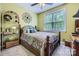 Comfortable bedroom featuring a decorative wrought iron bed frame and natural light at 10836 Maryanna Ct, Charlotte, NC 28213