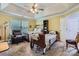 Bedroom featuring two beds, recliner, tray ceiling and ceiling fan at 10836 Maryanna Ct, Charlotte, NC 28213