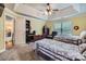 Bedroom with tray ceiling features 2 beds, a desk, and natural light at 10836 Maryanna Ct, Charlotte, NC 28213
