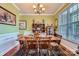 Traditional dining room featuring hardwood floors, ample seating, and a built-in hutch with decor at 10836 Maryanna Ct, Charlotte, NC 28213