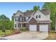 Spacious two-story home featuring a two-car garage and well-maintained lawn at 10836 Maryanna Ct, Charlotte, NC 28213