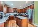 Spacious kitchen featuring a center island, stainless steel appliances, and custom wood cabinets at 10836 Maryanna Ct, Charlotte, NC 28213