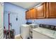 Practical laundry room featuring ample storage and modern appliances at 10836 Maryanna Ct, Charlotte, NC 28213