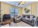 Cozy living room featuring plush seating, bright window and decorative accents at 10836 Maryanna Ct, Charlotte, NC 28213