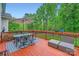 Inviting wooden deck with outdoor seating, ideal for relaxing and enjoying nature at 10836 Maryanna Ct, Charlotte, NC 28213