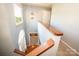 Bright foyer featuring hardwood floors, staircase, and a stylish pendant light fixture at 11024 Hunters Trace None, Charlotte, NC 28262
