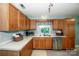 Bright kitchen with laminate countertops and stainless steel dishwasher at 11024 Hunters Trace None, Charlotte, NC 28262