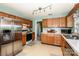Efficient kitchen features stainless steel refrigerator and ample cabinets at 11024 Hunters Trace None, Charlotte, NC 28262