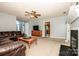 Comfortable living space with a fireplace, neutral walls, and open access to kitchen at 11024 Hunters Trace None, Charlotte, NC 28262