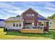 Exterior view of a brick two-story home with a deck and a well-maintained lawn at 1105 Hoyle Ln, Waxhaw, NC 28173