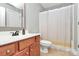 Bright bathroom featuring a white sink vanity, mirror, and shower curtain at 1105 Hoyle Ln, Waxhaw, NC 28173