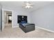 Bright bedroom with ceiling fan, neutral walls, and a small bed with storage at 1105 Hoyle Ln, Waxhaw, NC 28173