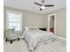Neutral bedroom with a floral accent chair and view into ensuite bathroom at 1105 Hoyle Ln, Waxhaw, NC 28173