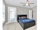 Bedroom with a large bed, ceiling fan, and a door leading to the outside at 1105 Hoyle Ln, Waxhaw, NC 28173
