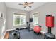Well-lit exercise room features a ceiling fan and a variety of exercise equipment at 1105 Hoyle Ln, Waxhaw, NC 28173