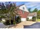 A beautiful two-story home with a brick exterior, a two-car garage, and a well-manicured lawn at 1105 Hoyle Ln, Waxhaw, NC 28173