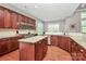 Well-equipped kitchen featuring a large island, wooden cabinets, and plenty of counter space at 1105 Hoyle Ln, Waxhaw, NC 28173