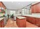 Spacious kitchen featuring granite countertops, wooden cabinetry, and stainless steel appliances at 1105 Hoyle Ln, Waxhaw, NC 28173