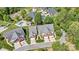Aerial view of upscale homes with manicured lawns and a community pool nestled in a lush, green landscape at 1119 21St Ne Ave, Hickory, NC 28601