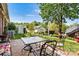 Charming backyard featuring a brick patio with outdoor seating, lush greenery, and a detached shed at 1119 21St Ne Ave, Hickory, NC 28601