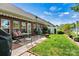 Well-maintained brick patio with seating, a manicured lawn, and a charming exterior view of the home at 1119 21St Ne Ave, Hickory, NC 28601
