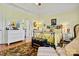 Well-lit bedroom with wood floors features neutral tones, complemented by a tray ceiling and stylish accents at 1119 21St Ne Ave, Hickory, NC 28601