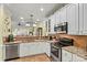 Well-equipped kitchen with stainless steel appliances, granite countertops, and ample cabinet space at 1119 21St Ne Ave, Hickory, NC 28601
