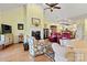Cozy living room with vaulted ceiling, fireplace, and open kitchen view at 1119 21St Ne Ave, Hickory, NC 28601