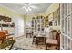 Spacious, bright office space with custom shelves, decor, and a beautiful rug creating a cozy and creative atmosphere at 1119 21St Ne Ave, Hickory, NC 28601