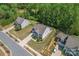 Aerial view of a lovely home, showcasing its well-maintained lawn, landscaping, and neighborhood at 112 Serravista St, Mooresville, NC 28117