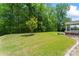 Lush green backyard and trees at 112 Serravista St, Mooresville, NC 28117