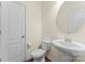 Clean, well-lit half bathroom featuring modern fixtures, a pedestal sink, and neutral tones at 112 Serravista St, Mooresville, NC 28117