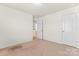 Bedroom with carpet flooring, neutral walls, and closet at 112 Serravista St, Mooresville, NC 28117