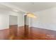 Elegant dining area features hardwood floors, decorative light fixture, and an open design for entertaining at 112 Serravista St, Mooresville, NC 28117
