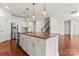 Eat-in kitchen featuring granite counters, a large island, and stainless steel appliances at 112 Serravista St, Mooresville, NC 28117