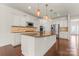 Gourmet kitchen with stainless steel appliances and a large island with bar seating at 112 Serravista St, Mooresville, NC 28117
