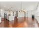 Open-concept living area with a fireplace and hardwood flooring, flowing into a kitchen at 112 Serravista St, Mooresville, NC 28117