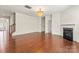 Spacious living room with a fireplace and wood floors at 112 Serravista St, Mooresville, NC 28117
