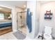 Modern bathroom featuring a glass-enclosed shower with a built-in seat, complemented by sleek fixtures and neutral tones at 1165 Old Salisbury Concord Rd, Concord, NC 28025