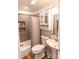 Cozy bathroom featuring a shower-tub combo, toilet, and pedestal sink at 1165 Old Salisbury Concord Rd, Concord, NC 28025
