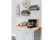 Kitchen corner featuring a stylish stand mixer, decorative spice racks, and a butcher block countertop on a gray kitchen island at 1165 Old Salisbury Concord Rd, Concord, NC 28025