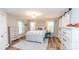 Serene main bedroom featuring hardwood floors, a comfortable bed, and stylish furnishings at 1165 Old Salisbury Concord Rd, Concord, NC 28025