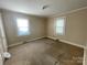 Bedroom with two windows and beige carpeting. Neutral walls create a relaxing space at 1218 Forestdale Dr, Salisbury, NC 28144