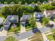 Aerial view of homes in a residential neighborhood with manicured lawns and mature trees at 12404 Mcallister Park Dr, Charlotte, NC 28277