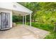 Covered back patio featuring a ceiling fan and a concrete floor at 12404 Mcallister Park Dr, Charlotte, NC 28277