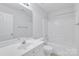 A full bathroom with a single sink vanity, mirror, toilet and shower with tub at 12404 Mcallister Park Dr, Charlotte, NC 28277